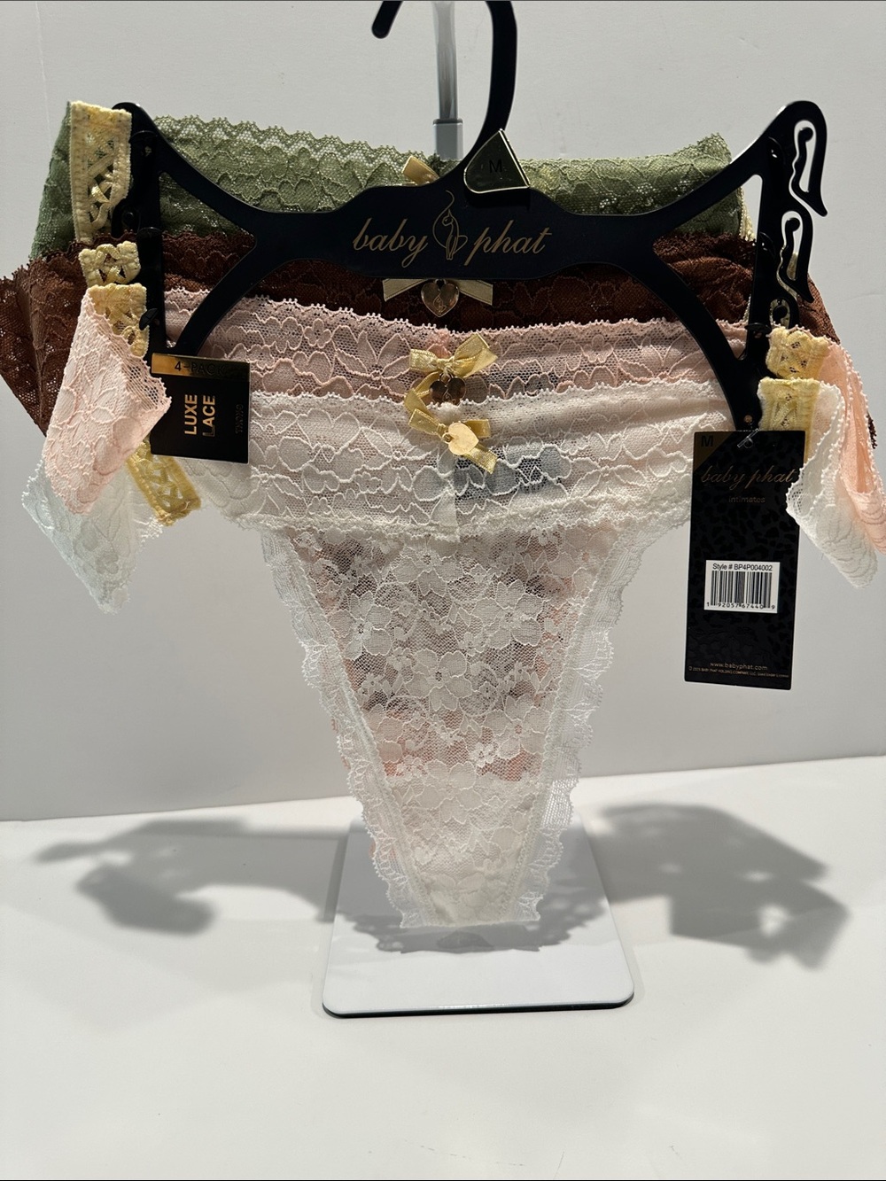 NWT Baby Phat Luxe Lace (4) Set Thongs with bow and goldtone heart on the front.